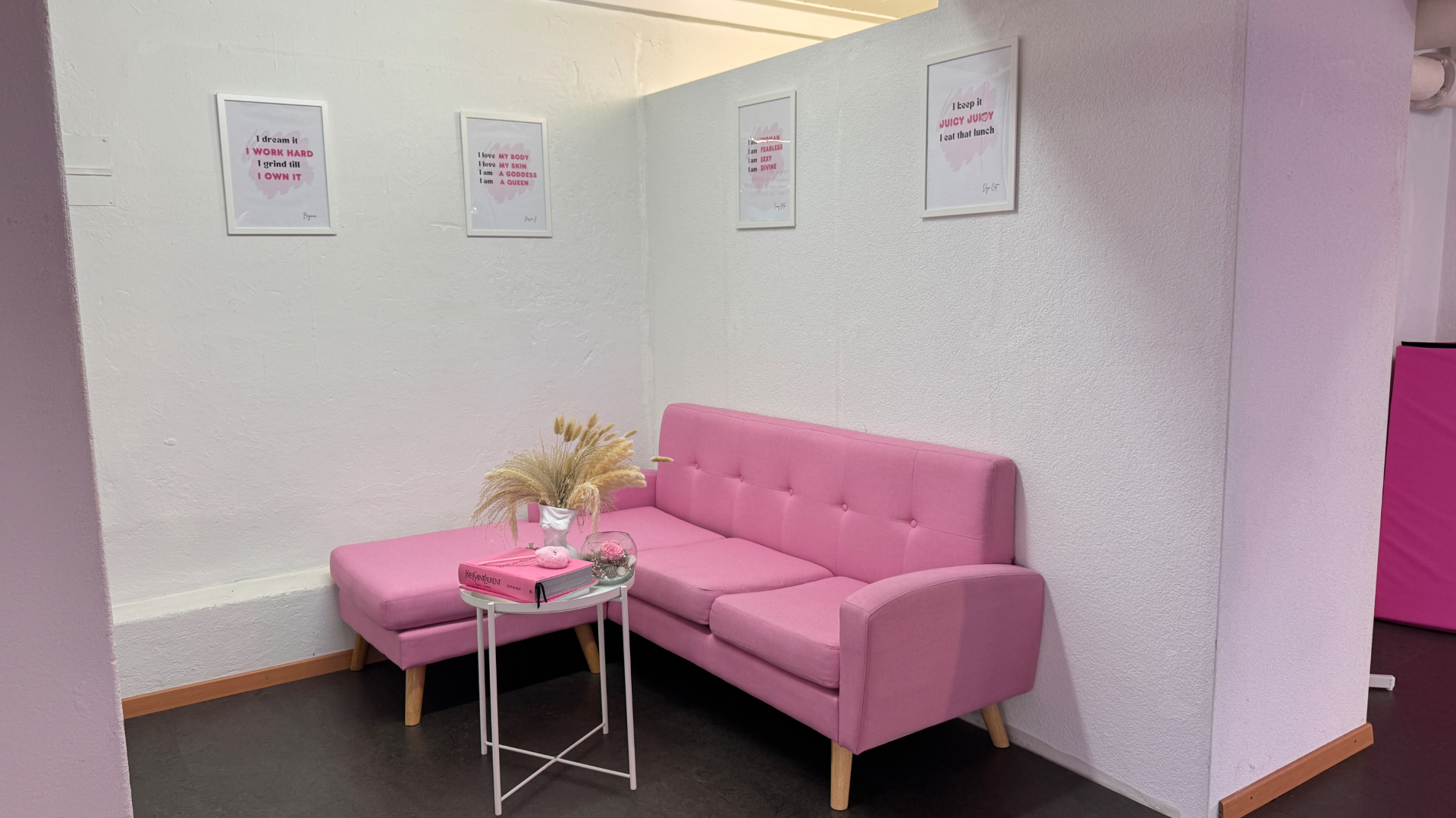 Pink lounge corner with posters