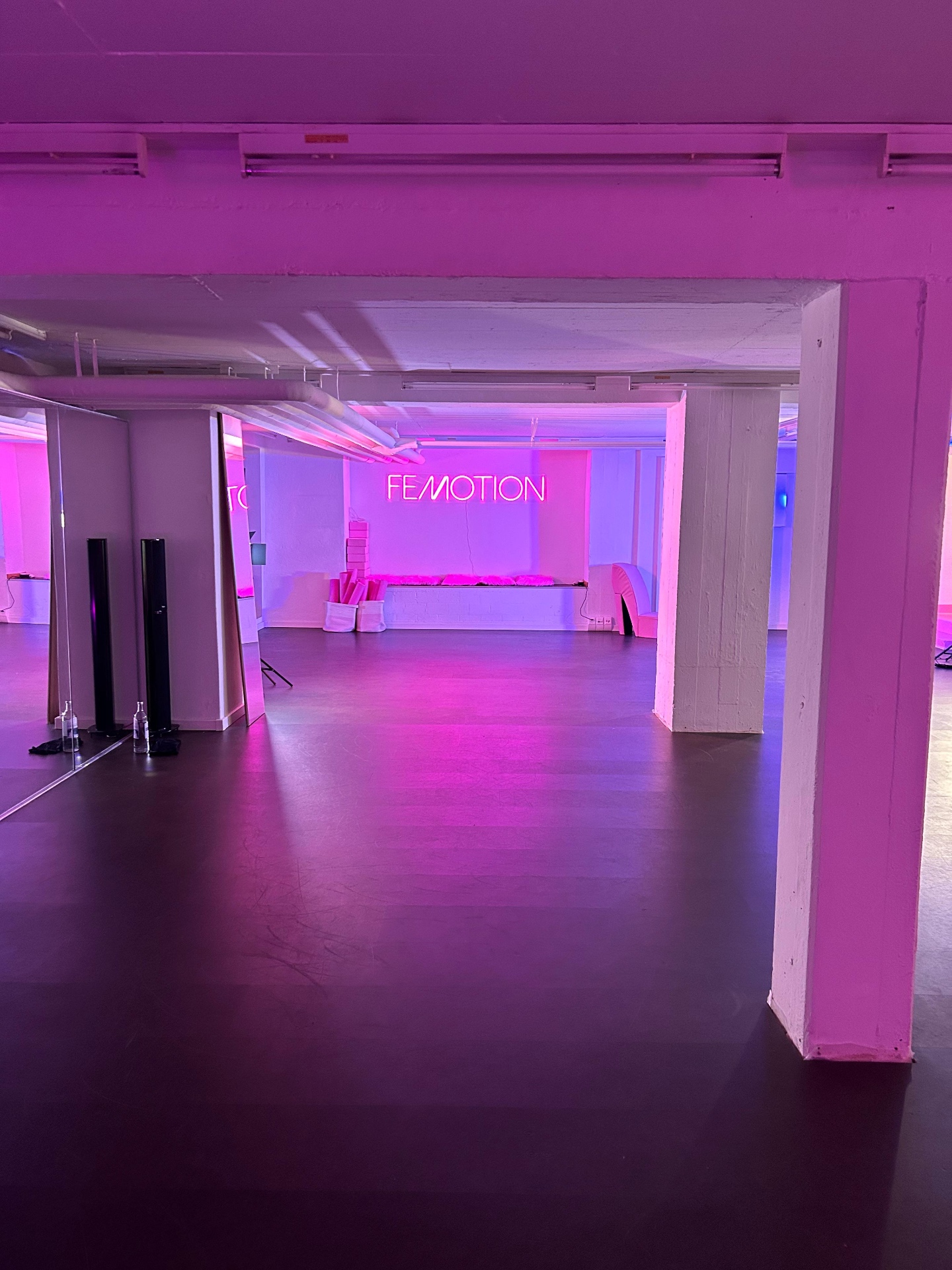Studio interior with mirrors and neon lighting
